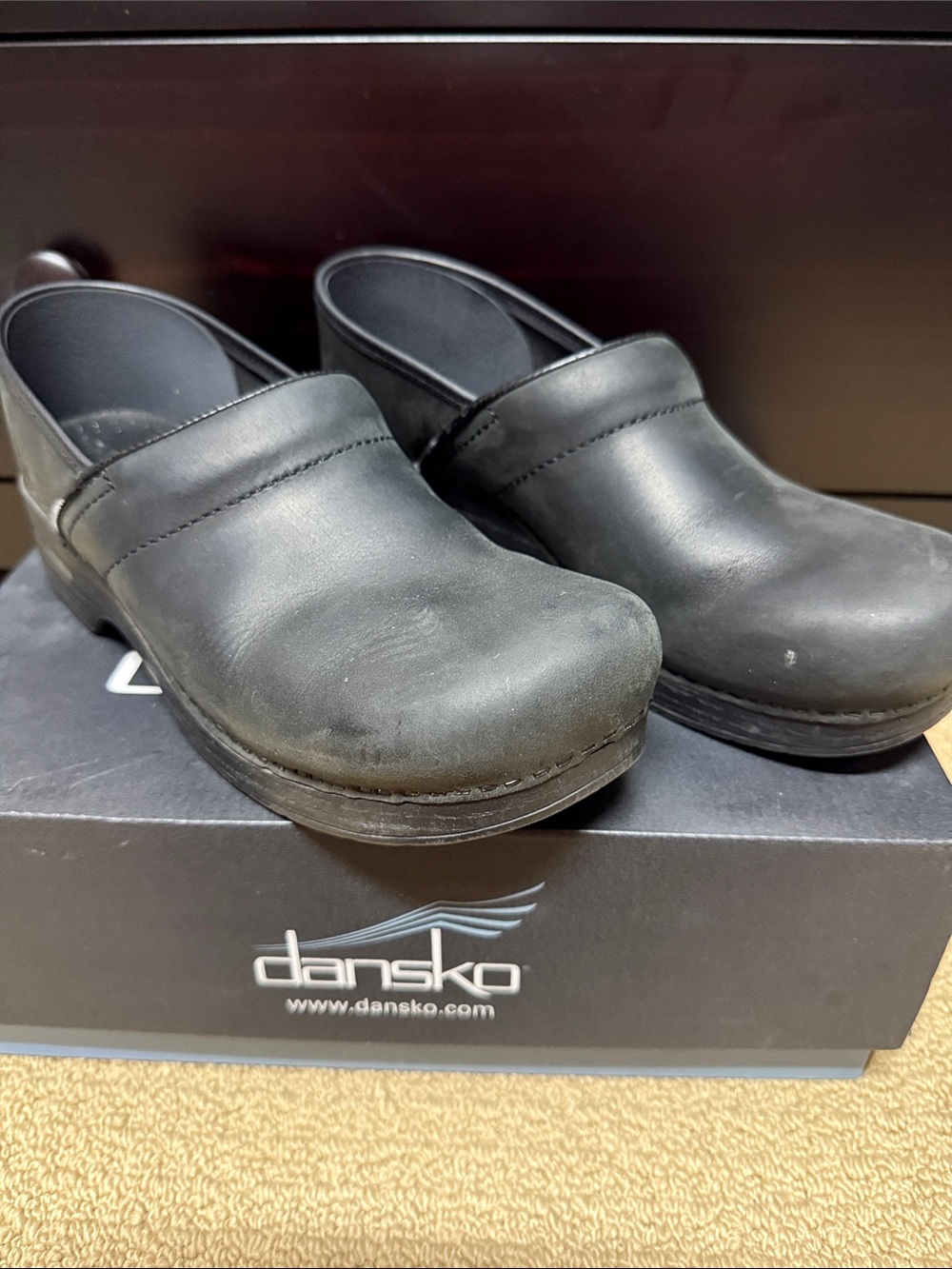 Dansko Black Leather Women’s Slip-On Clogs